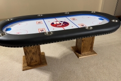 Custom poker table with New York Islanders hockey theme.