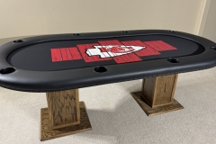 Kansas City Chiefs custom poker table with the chiefs arrowhead logo in red. Black rail and black cup holders.