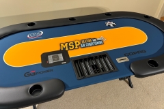 Custom printed poker table gaming cloth with commercial logo in the center and an automatic card shuffler