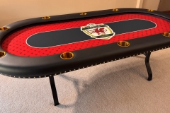 Custom poker table with customers league logo in the center, red and black color with gold powder coated cup holders