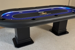 Custom home game poker table featuring the customers personal logo and led lights.