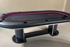 Custom poker table with a casino style base, custom printed gaming cloth and led lights.