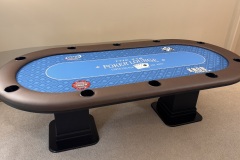 Custom poker table with blue gaming cloth and black base