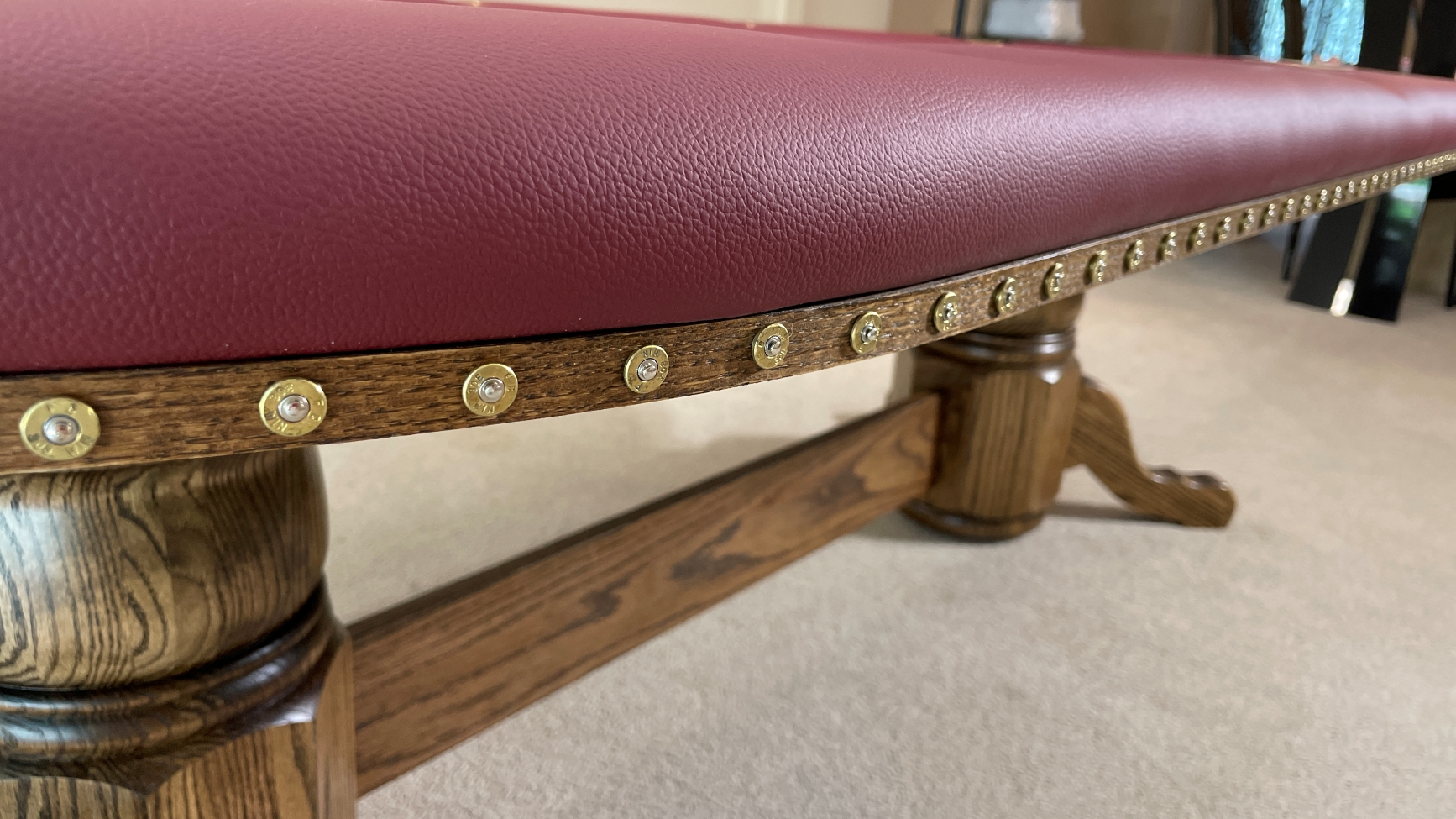 Bullet Slices poker table with oak edge banding and real bullet slices