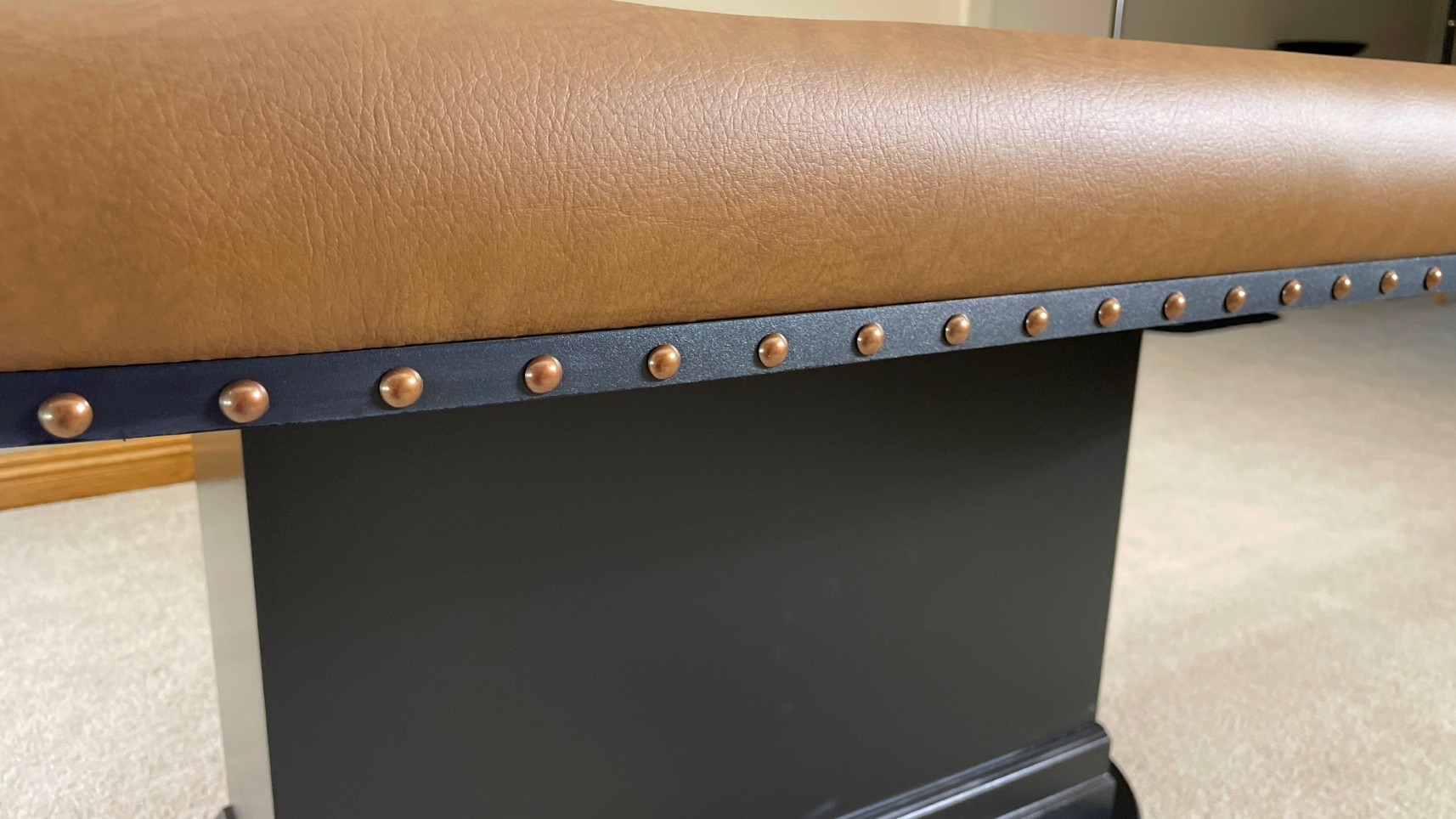 Copper Nail Heads poker table with black edge banding and copper decorative nail heads