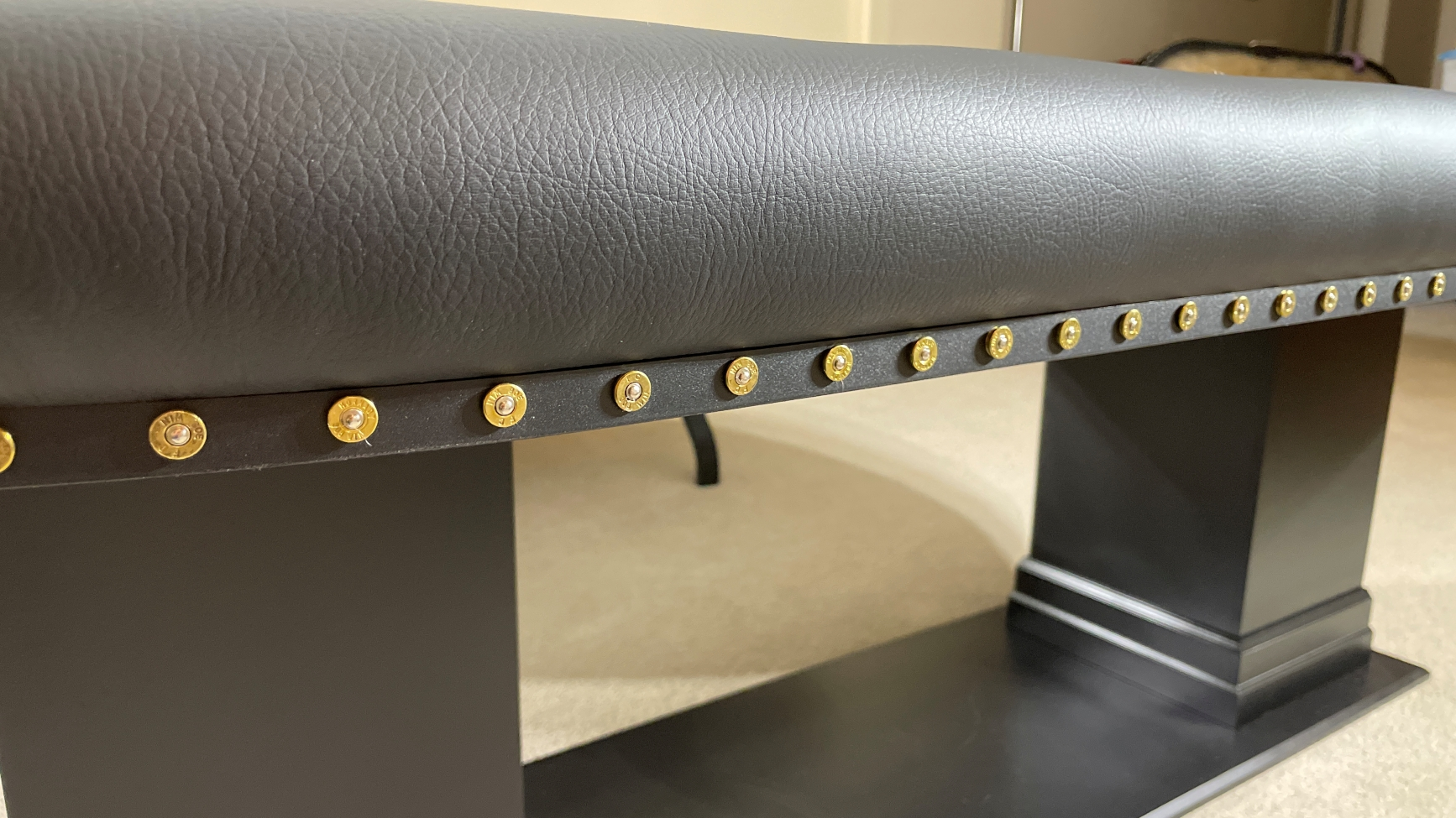 Gold Bullet Slices poker table with black edge banding and real bullet slices