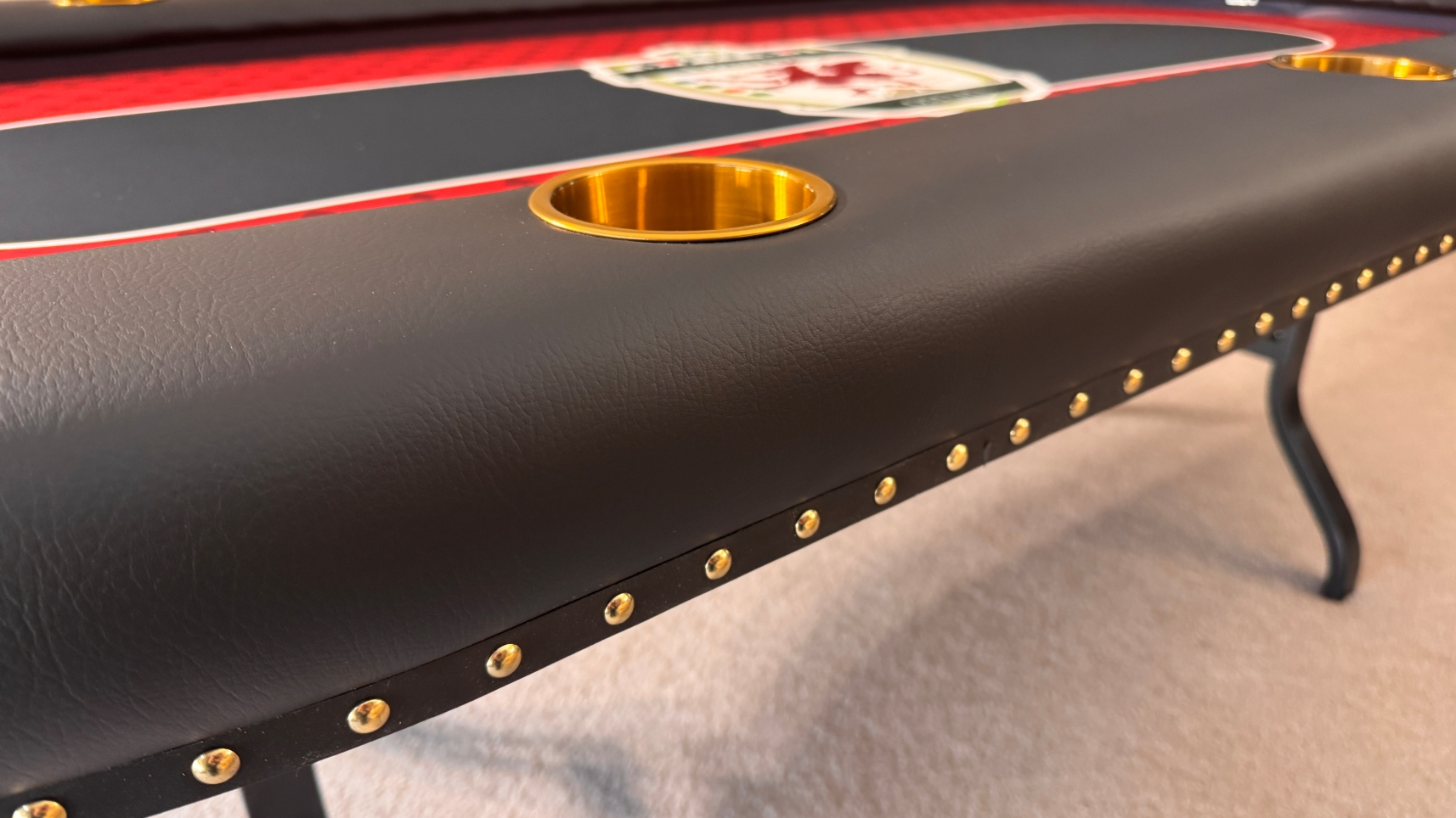 Gold Deco Nail Heads poker table with black edge banding and gold decorative nail heads